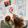 A woman and a child are sitting at a table, working on a perler bead craft project. Produktbild-Vorschau