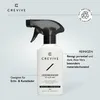 A product shot of a white spray bottle with a black trigger, featuring branding and descriptive text. Produktbild-Vorschau