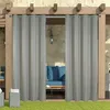 Outdoor curtains hanging on a pergola, with a sofa visible behind them. Náhled obrázku produktu