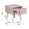 A pink bedside table with dimensions indicated by measurement lines and text. Produktbild-Vorschau