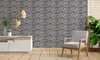 A living room scene with a wall paneling product displayed on the wall, along with furniture and plants. Produktbild-Vorschau