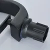 A close-up view of a black faucet component, showing a connection point with a blue rubber seal. Podgląd zdjęcia produktu