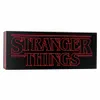 A black rectangular object with the red 'Stranger Things' logo on it, presented against a white background. Produktbild-Vorschau