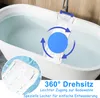 A white bathtub filled with water, with a white bath seat placed across the rim. The seat has a blue handle and a blue circular graphic with arrows indicating rotation. A close-up inset shows the textured surface of the seat with water droplets. Produktbild-Vorschau