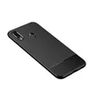 A black carbon fiber textured phone case is shown from a diagonal angle against a white background. Produktbild-Vorschau