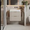 A modern bathroom vanity with a sink, faucets, and towels. Náhled obrázku produktu