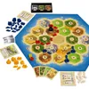 A board game with hexagonal tiles representing land and sea, along with game pieces and dice. Náhled obrázku produktu