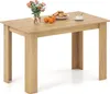 A wooden dining table with a vase of flowers, cookies, and a cup of tea on it. Náhled obrázku produktu