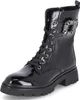 A black patent leather lace-up boot with a decorative jeweled buckle on the side. Produktbild-Vorschau