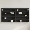 A black display cabinet with multiple shelves mounted on a textured white wall. Produktbild-Vorschau