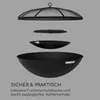 An exploded view of a black metal fire pit and its components, including a mesh spark screen, a grill grate, and the main fire bowl, set against a plain gray background. Produktbild-Vorschau