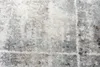 A close-up view of a textured rug with a distressed pattern. Anteprima dell’immagine prodotto