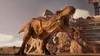 A dinosaur roaring in a rocky, arid environment with a building in the background. Náhled obrázku produktu