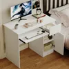 A white computer desk with a keyboard, monitor, and books. Podgląd zdjęcia produktu