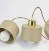Close-up view of a modern beige LED pendant lamp with gold accents. Produktbild-Vorschau