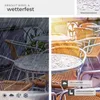 A split image showing outdoor cafe tables and chairs. The left side depicts rain falling on the tables, while the right side shows the tables in sunlight with water droplets, highlighting their water-repellent feature. Náhled obrázku produktu