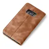 A brown leather flip case for a smartphone is shown from a diagonal top-down view against a white background. Produktbild-Vorschau