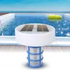 A solar-powered pool ionizer floats in a swimming pool next to a yellow inflatable ring. Produktbild-Vorschau