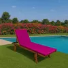 A pink chaise lounge cushion is placed on a wooden lounge chair next to a swimming pool, with a colorful hedge and trees in the background. Anteprima dell’immagine prodotto
