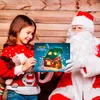 Santa Claus and a young girl are holding an advent calendar with a Christmas house design. Náhľad obrázku produktu