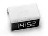 A white digital alarm clock with a wireless charging pad on top, shown against a white background. Produktbild-Vorschau