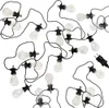 A string of LED lights with clear bulbs and black cords, arranged in a scattered pattern on a white background. Podgląd zdjęcia produktu