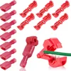 A collection of red wire connectors and a green wire. Produktbild-Vorschau