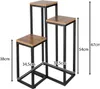 A 3-tier plant stand with wooden shelves and a black metal frame, shown against a white background with dimensions indicated. Produktbild-Vorschau