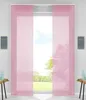 Two pink panel curtains hanging in a window, with a view of trees and sky outside. Produktbild-Vorschau