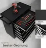 A black tool cart with various tools organized in its drawers, including screwdrivers and a drill. Text overlays highlight features. Produktbild-Vorschau