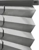 A close-up view of a gray pleated blind, showing its texture and folded structure. Produktbild-Vorschau