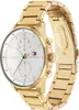 A close-up, studio shot of a gold Tommy Hilfiger watch against a white background. Produktbild-Vorschau