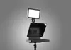A teleprompter device with a light attached, shown against a plain gray background. Náhľad obrázku produktu