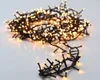 A tangled string of warm white LED cluster lights on a white background. Produktbild-Vorschau