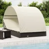 A daybed with a canopy is situated on a patio next to a swimming pool. Produktbild-Vorschau