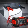 A car battery charger is connected to a car battery. Podgląd zdjęcia produktu