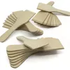 A collection of wooden spatulas or scrapers arranged on a white surface. Produktbild-Vorschau