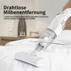 A white cordless vacuum cleaner is being used on a white bed. Decorative bottles and glasses are on a nightstand in the background. Produktbild-Vorschau