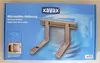 The image shows the packaging of a microwave bracket, with a product image on the front. Náhľad obrázku produktu