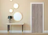 A hallway or entryway scene with a console table, a lamp, and several decorative mirrors on the wall, next to a closed door. Produktbild-Vorschau