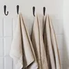 10 Stueck schwarze kleine Haken an der Wand montiert mit 20 Produktbild-Vorschau 6