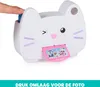 A close-up of a white cat-shaped toy camera with a finger pressing a blue button on top. Produktbild-Vorschau
