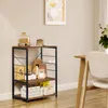 A kitchen shelf unit with various items on it, placed in a room with a chair and table. Produktbild-Vorschau