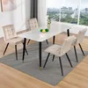 A dining set with four chairs and a table in a room with a large window overlooking a city. Produktbild-Vorschau
