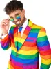 A man wearing a rainbow-striped suit and tie, with star-shaped glasses. Produktbild-Vorschau