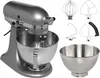 A silver KitchenAid stand mixer with multiple attachments and a bowl, displayed on a light gray background. Anteprima dell’immagine prodotto