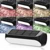 A collage of solar-powered wall lights mounted on a stone wall, showing different color lighting effects, with a larger, clear view of the product at the bottom. Produktbild-Vorschau