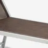 A close-up view of a section of a chaise lounge chair, showing the woven fabric seat and the aluminum frame. Anteprima dell’immagine prodotto