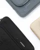 Three laptop sleeves are shown on a white background, with water droplets on them. Produktbild-Vorschau