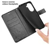 A hand is holding a black phone case, showing its interior and the wallet part of the case. Produktbild-Vorschau
